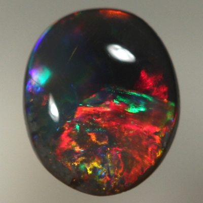 SOLID BLACK OPAL Bright, rich cherry red rolling flashes